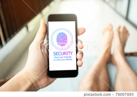 Man on holiday using smartphone to sign a password by Fingertip. Mobile Security Concept. 78007893