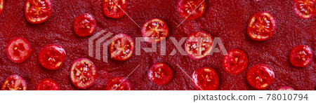 Tomato slice pattern on a red tomato paste or Ketchup background. Flat lay, top view Tomato slice pattern on a red tomato paste or Ketchup background. Flat lay, top view 78010794