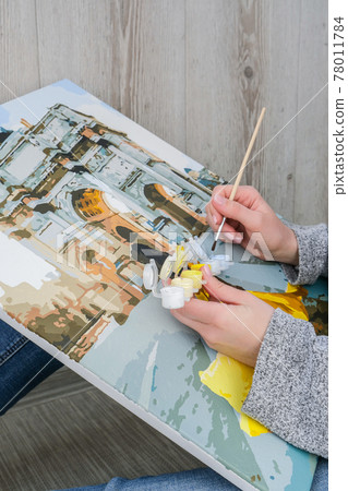 Female hands coloring canvas Picture by numbers girl Triumphal Arch Paris. Creative hobby. Painting for beginners. Leisure activity for stay home isolation, anti-stress idea. Meditation, relax concept Female hands coloring canvas Picture by numbers girl Triumphal Arch Paris. Creative hobby. Painting for beginners. Leisure activity for stay home isolation, anti-stress idea. Meditation, relax concept 78011784