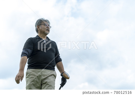Senior man enjoying ground golf 78012516
