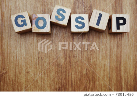 gossip word alphabet letter on wooden background 78013486