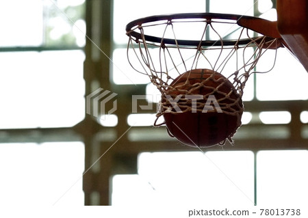 Basketball goal at the moment when a basketball shot enters Basketball goal at the moment when a basketball shot enters 78013738