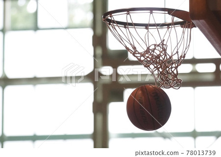 Basketball goal at the moment when a basketball shot enters 78013739