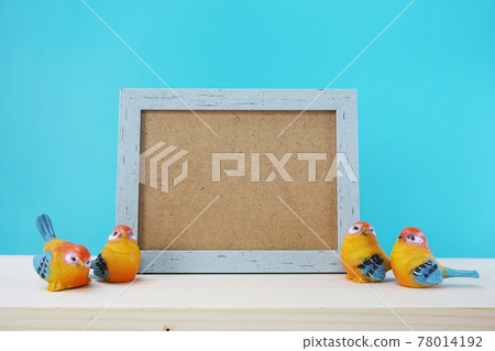 photo frame and home decoration on blue background photo frame and home decoration on blue background 78014192