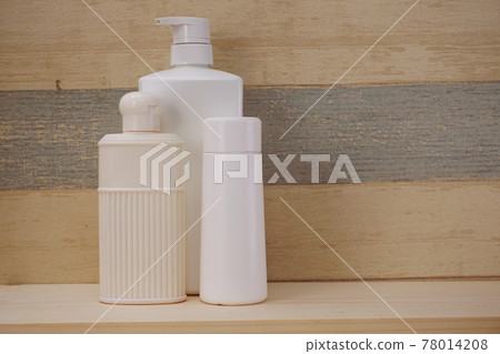 plastic bottles of body care and beauty products 78014208