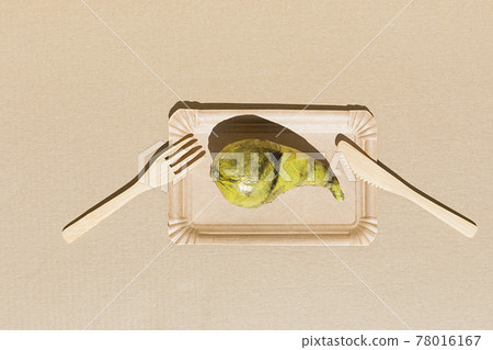 Pear wrapped plastic. Immature, tasteless or inedible food concept. Pear wrapped plastic. Immature, tasteless or inedible food concept. 78016167