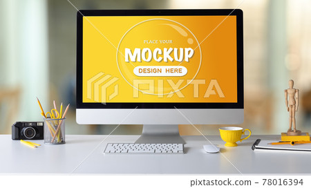 Mock up computer with blank screen, coffee cup, pencil holder and camera on white desk. Mock up computer with blank screen, coffee cup, pencil holder and camera on white desk. 78016394