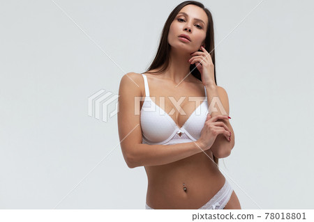 Slim woman in lingerie in studio 78018801