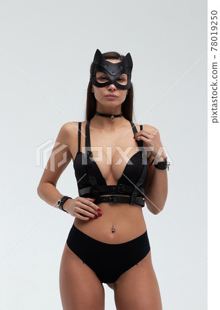 Sexy woman in black mask and lingerie in studio 78019250