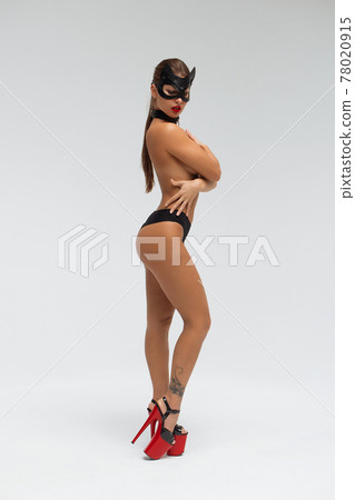 Sexy topless woman in black mask 78020915