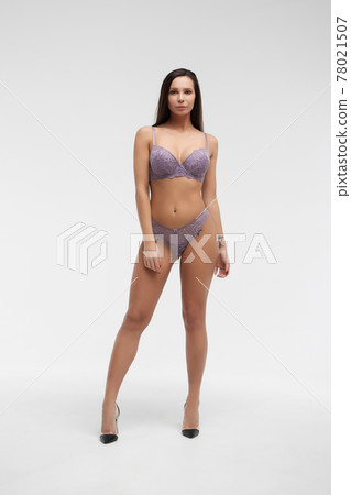 Young woman in lingerie in studio 78021507