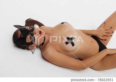 Sensual slim woman in black mask and collar Sensual slim woman in black mask and collar 78022051