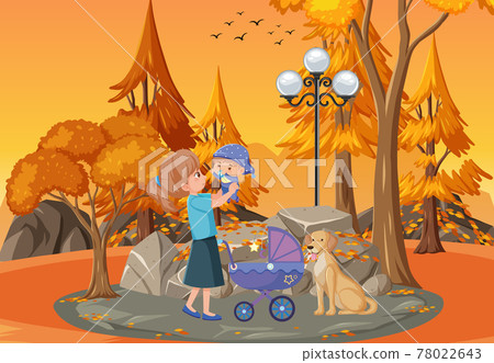 Park scene at sunset time with mother and daughter 78022643