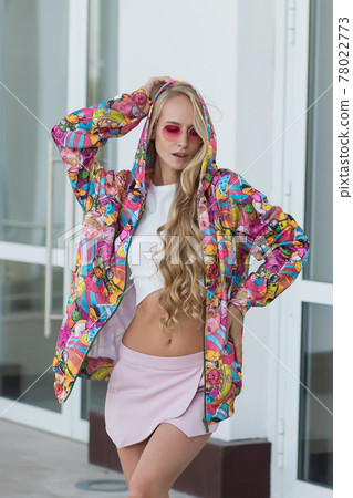 Trendy female leaning on railing 78022773