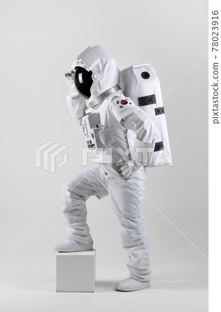 astronaut with raised legs, white background astronaut with raised legs, white background 78023916
