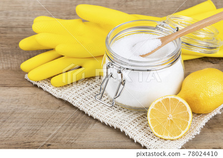 Zero waste cleaning - powdered citric acid, wood spoon and lemon 78024410