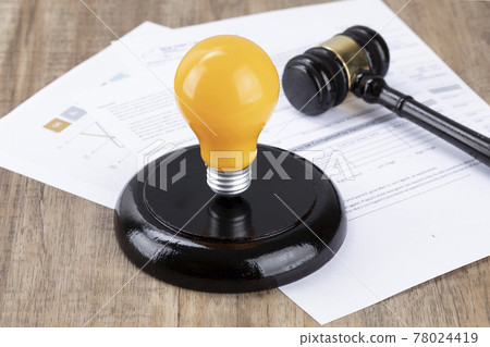 Crime and law - Documents and yellow bulbs and gavel Crime and law - Documents and yellow bulbs and gavel 78024419