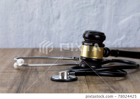 Crime and law - stethoscope and gavel Crime and law - stethoscope and gavel 78024425