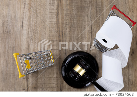 Crime and law - a miniature shopping cart with a receipt and gavel Crime and law - a miniature shopping cart with a receipt and gavel 78024568