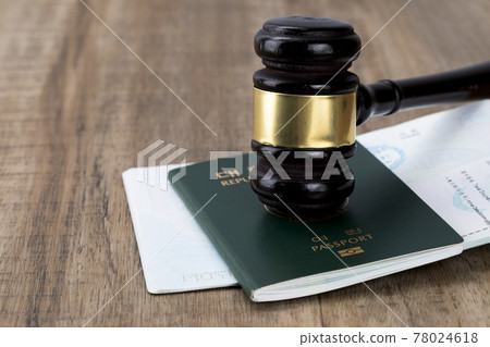 gavel placed on the passport - Crime and the Law gavel placed on the passport - Crime and the Law 78024618