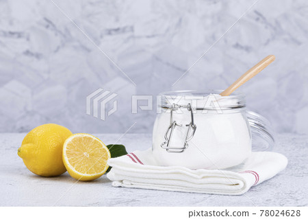 Zero waste cleaning - powdered citric acid, wood spoon and lemon 78024628