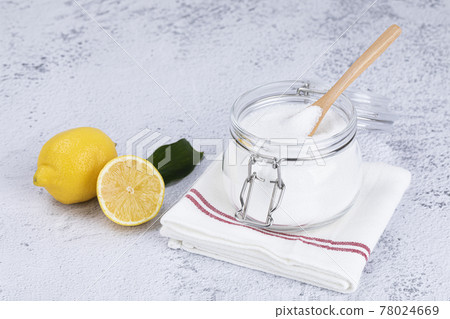 Zero waste cleaning - powdered citric acid, wood spoon and lemon 78024669