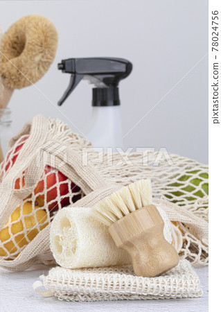 Zero waste products - stainless straw, wood board, sprayer and natural loofah, net bag with fruit and cleaning brush 78024756