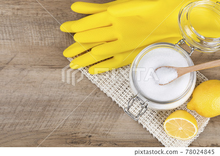 Zero waste cleaning - powdered citric acid, wood spoon and lemon 78024845