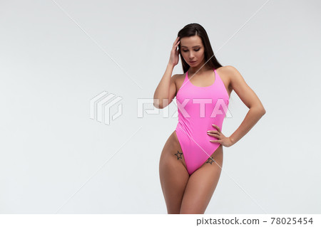 Slim woman in swimwear with sunglasses 78025454