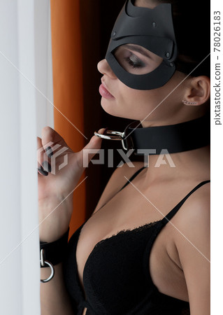 Brunette girl in a cat mask 78026183