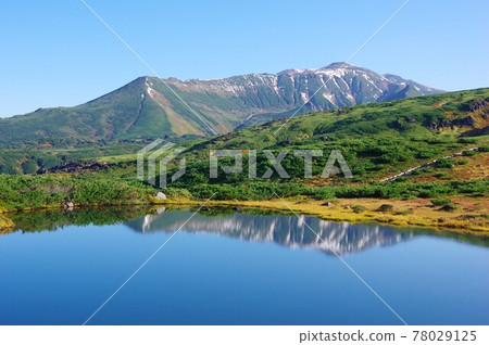 Mt. Asahidake, Hokkaido, Mt. Toma and Mt. Antaroma reflected in Kagamiike 78029125