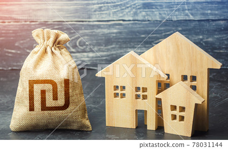 Israeli shekel money bag and figurines of residential buildings. Property tax. Financing urban development and infrastructure projects. Municipal budgeting. Increase investment attractiveness 78031144