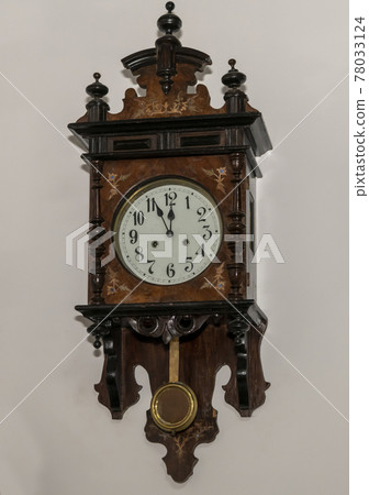 Vintage wooden clock with a pendulum Vintage wooden clock with a pendulum 78033124