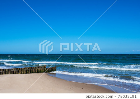 Groyne on the Baltic Sea coast in Kuehlungsborn, Germany Groyne on the Baltic Sea coast in Kuehlungsborn, Germany 78035191