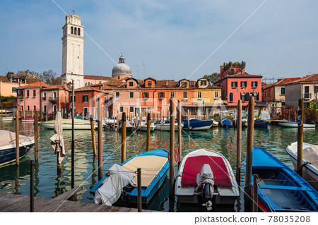Historical buildings with boats in the city Venice, Italy 78035208