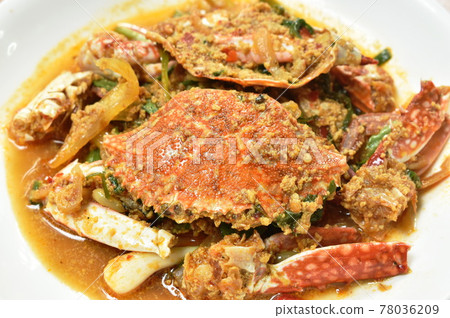stir fried swimmer crab in yellow curry and egg on plate stir fried swimmer crab in yellow curry and egg on plate 78036209