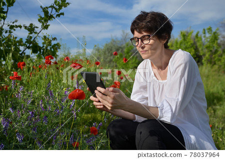 Woman In A Poppy Field Reading Tablet Book Woman In A Poppy Field Reading Tablet Book 78037964