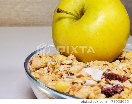 granola and green apple for breakfast. A healthy, gluten-free vegetarian breakfast 78038633