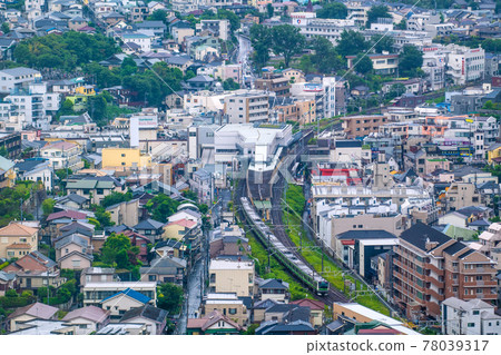 View of Japan's Yokohama cityscape, such as Kikuna Station and JR Yokohama Line trains 78039317