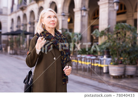 Portrait of an elegant elderly woman on spring street of european city 78040433