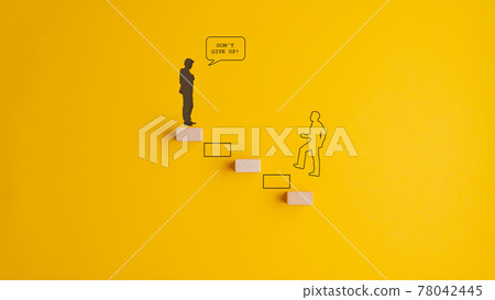 Silhouette of a man climbing up the stairway towards a Dont give up sign Silhouette of a man climbing up the stairway towards a Dont give up sign 78042445