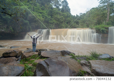 Back of tourist woman travel at Sri Dit Waterfall. Nature landscape of Khao Kho in natural park, Thailand in travel trip on holiday and vacation, tourist attraction. People lifestyle activity. 78044132