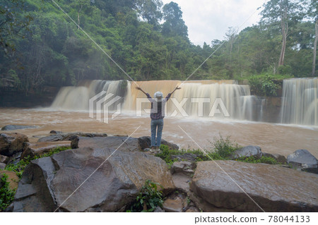 Back of tourist woman travel at Sri Dit Waterfall. Nature landscape of Khao Kho in natural park, Thailand in travel trip on holiday and vacation, tourist attraction. People lifestyle activity. 78044133