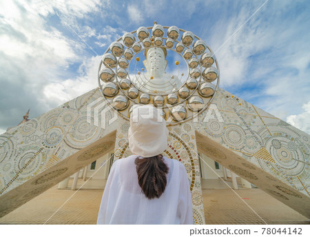 Back of Asian woman praying at Wat Phra Thart Pha Sorn Kaew Statue temple, Phetchabun, Thailand. Nature landscape. Travel trip on holiday and vacation. Thai tourist attraction. People lifestyle. 78044142