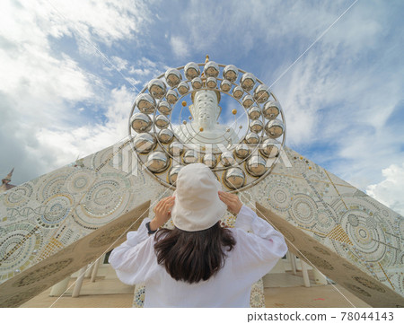 Back of Asian woman praying at Wat Phra Thart Pha Sorn Kaew Statue temple, Phetchabun, Thailand. Nature landscape. Travel trip on holiday and vacation. Thai tourist attraction. People lifestyle. 78044143