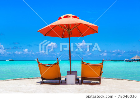 Sunbed and umbrella in the Maldives Sunbed and umbrella in the Maldives 78046036