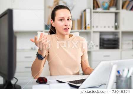 Portrait of successful business woman in modern office 78046394