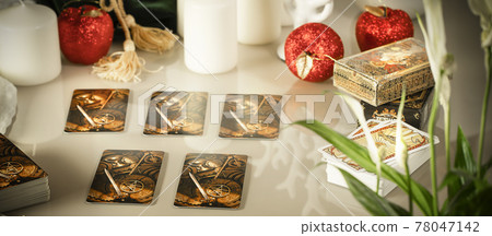 Defocused mystic ritual with tarot cards, fortune telling and esoteric symbols.  78047142