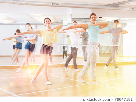 Teenagers are dancing hip hop in dance studio 78047191