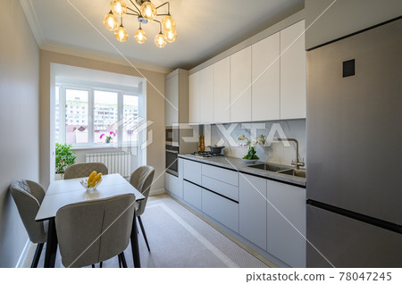 Modern gray and white kitchen interior Modern gray and white kitchen interior 78047245